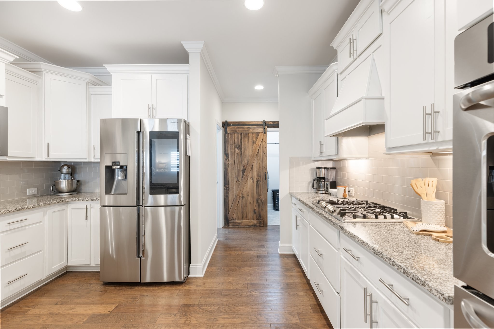1044 Scouting Drive Franklin, TN 37064 - Photo 40 of 87 a kitchen with stainless steel appliances granite countertop a refrigerator and a stove