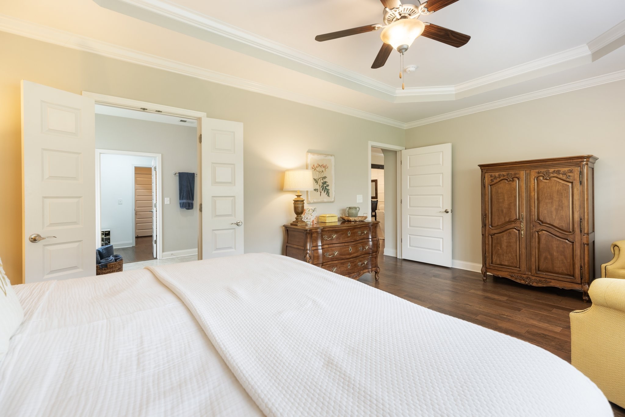 1044 Scouting Drive Franklin, TN 37064 - Photo 42 of 87 a spacious bedroom with a large bed a chandelier and closet