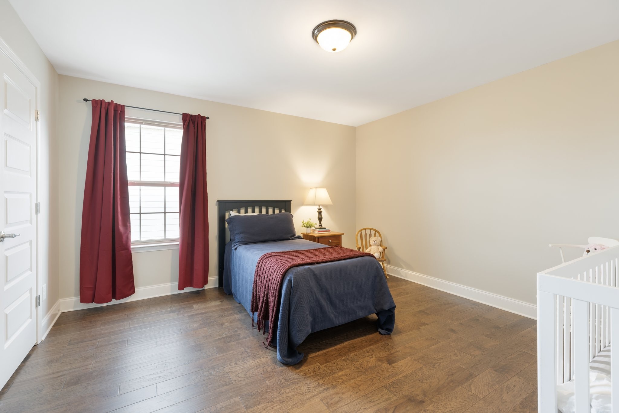 1044 Scouting Drive Franklin, TN 37064 - Photo 76 of 87 a bed sitting in a bedroom next to a window