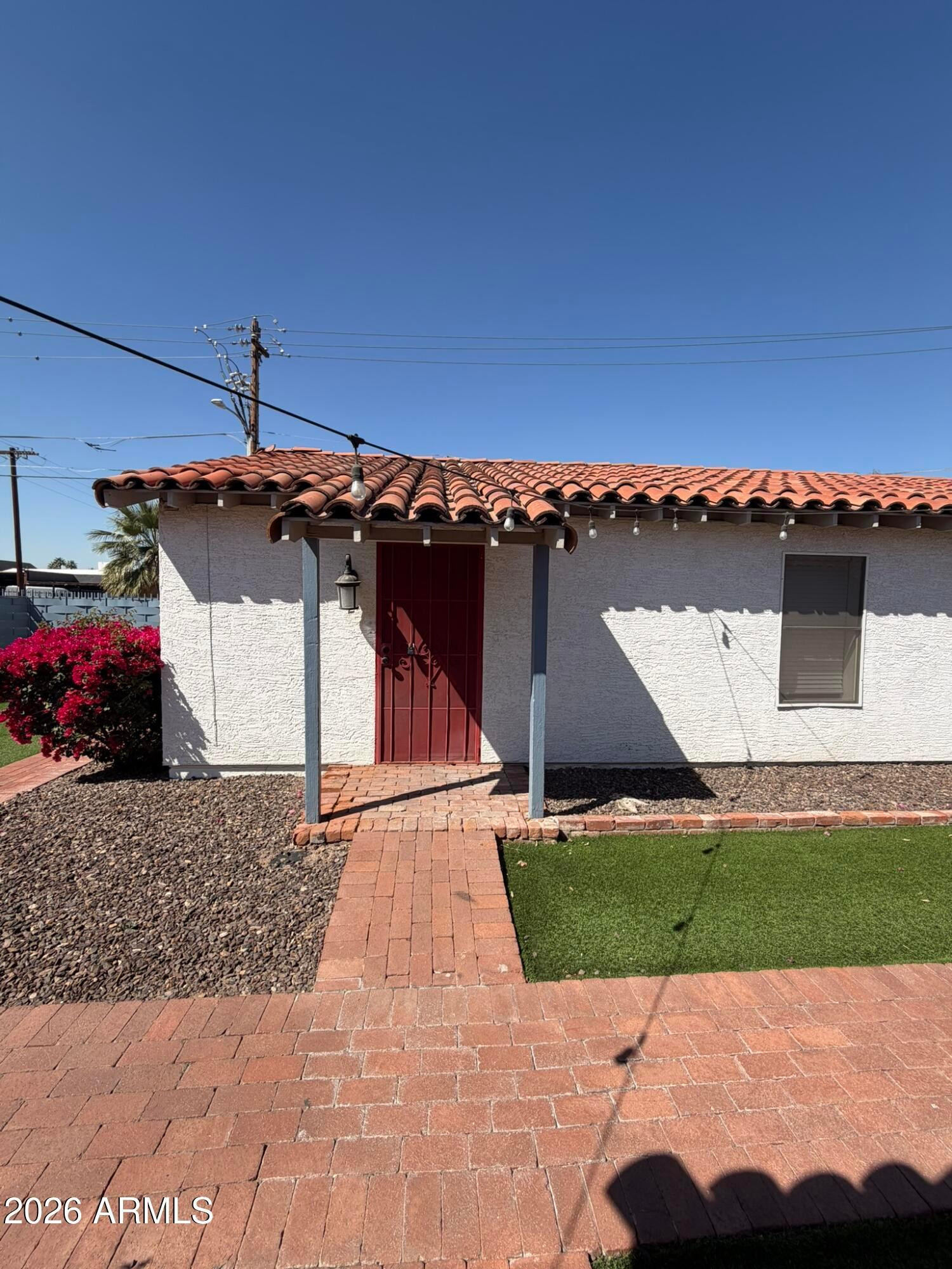 712 West Taylor Street, Unit 2 Phoenix, AZ 85007 - Photo 1 of 6 a view of a back yard of the house