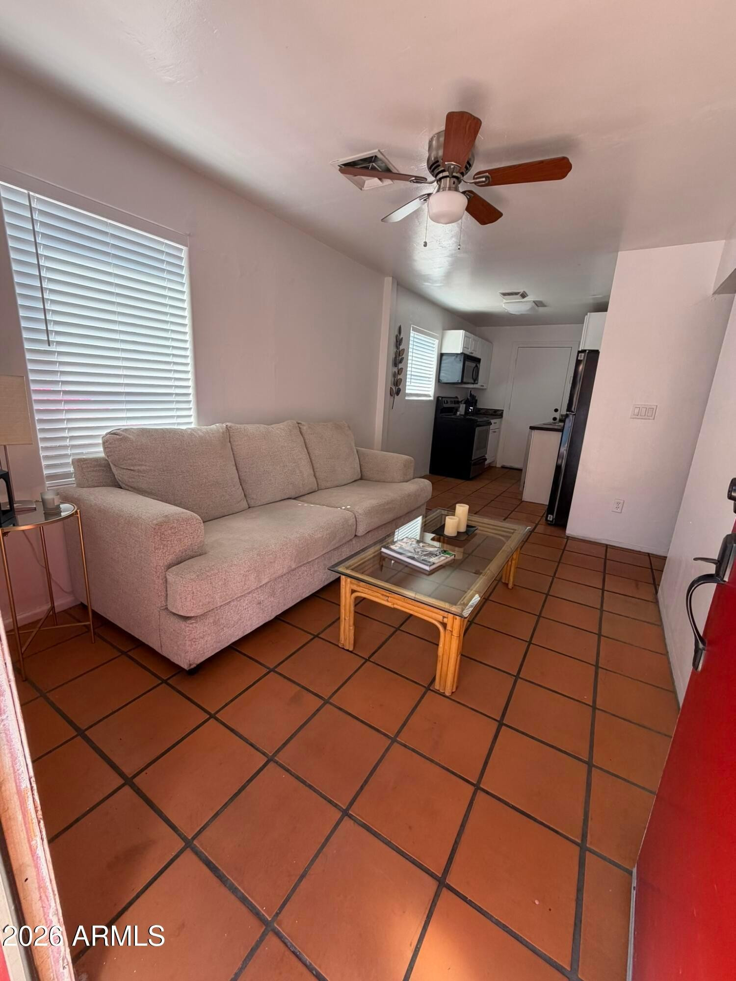 712 West Taylor Street, Unit 2 Phoenix, AZ 85007 - Photo 2 of 6 a living room with a couch and a coffee table