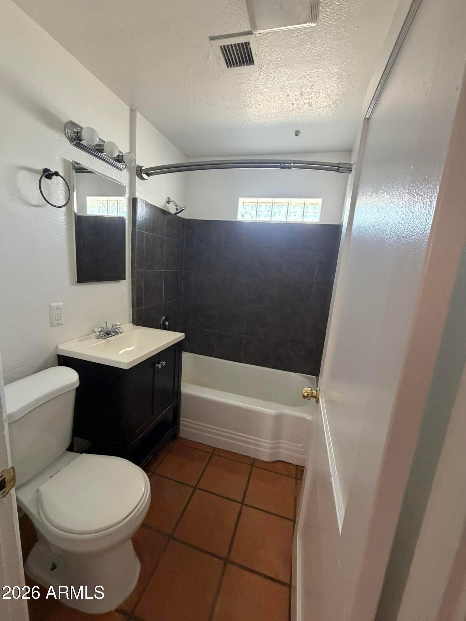 712 West Taylor Street, Unit 2 Phoenix, AZ 85007 - Photo 5 of 6 a bathroom with a sink toilet and shower