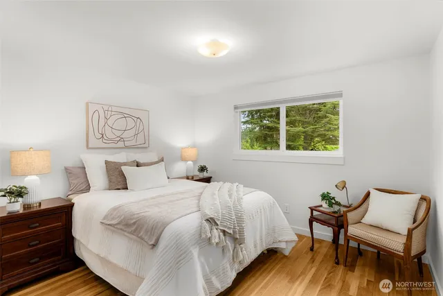 a bedroom with a bed and a chair