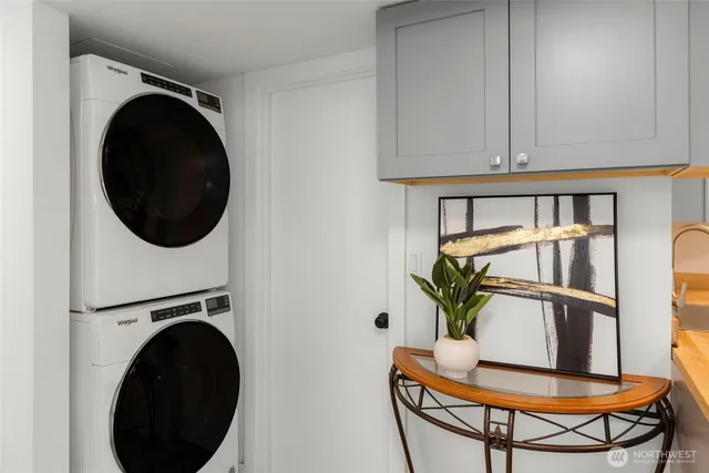 a view of a hallway with washer and dryer