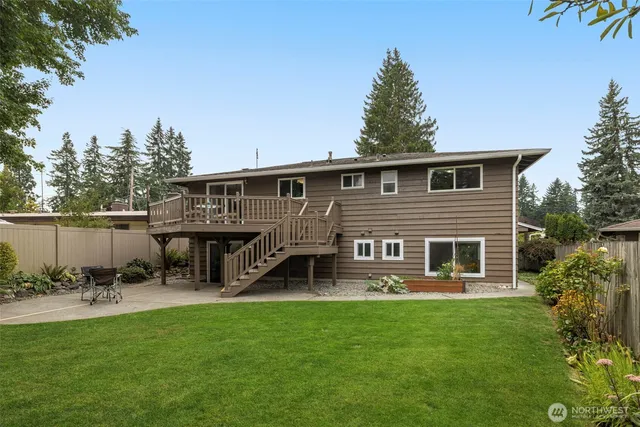 a view of a house with a yard porch and sitting area