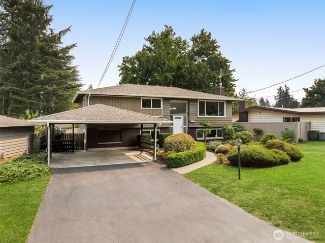 a front view of house with yard and outdoor seating