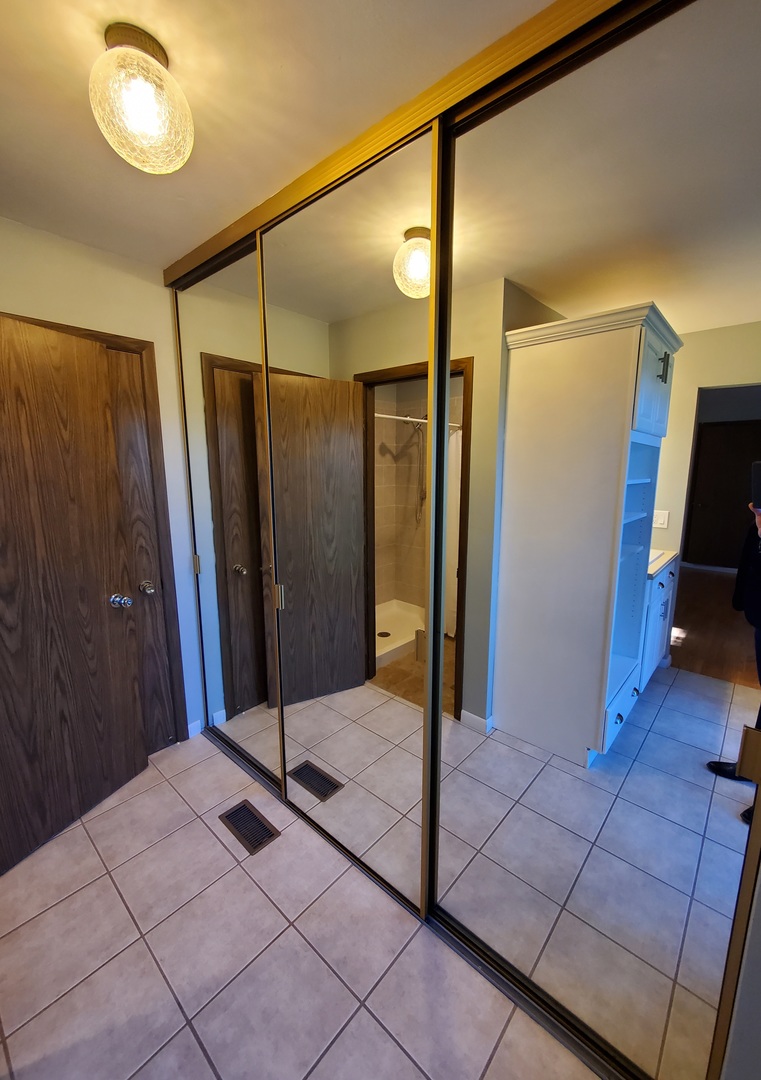 726 Chandler Road Gurnee, IL 60031 - Photo 24 of 43 a bathroom with a shower and a glass door