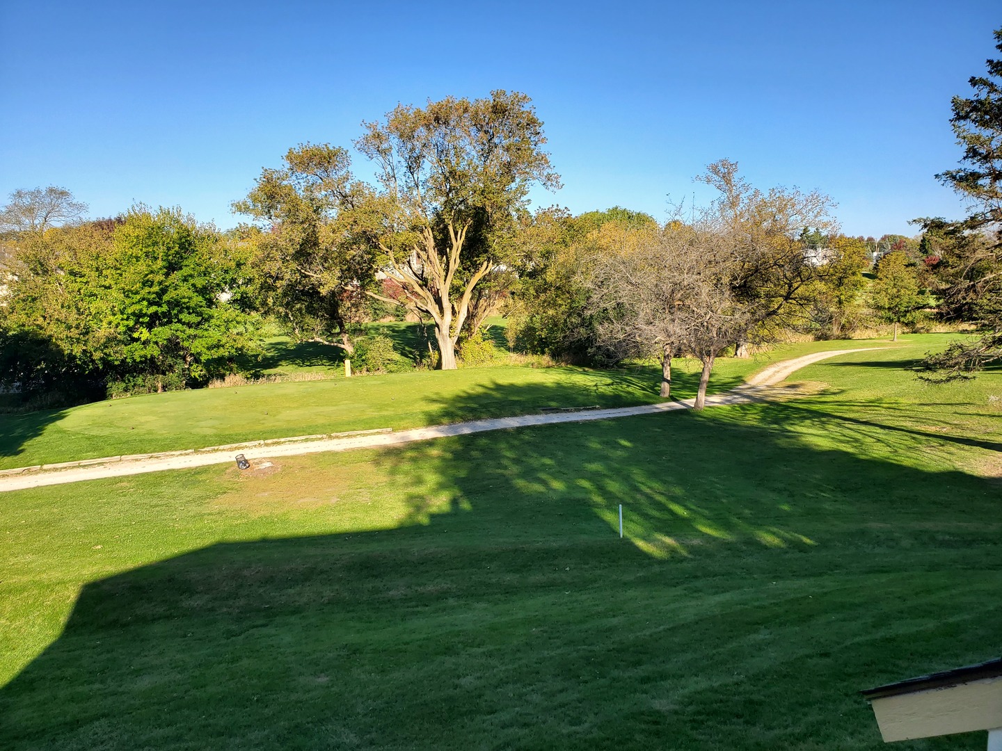 726 Chandler Road Gurnee, IL 60031 - Photo 32 of 43 a view of a golf course with a lake