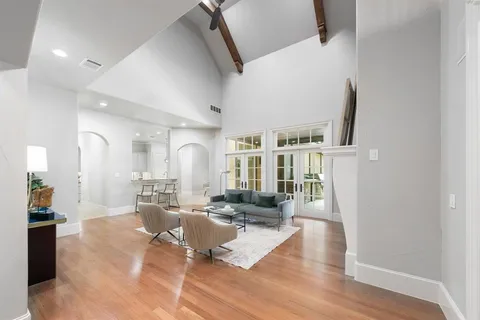 a living room with furniture window and wooden floor