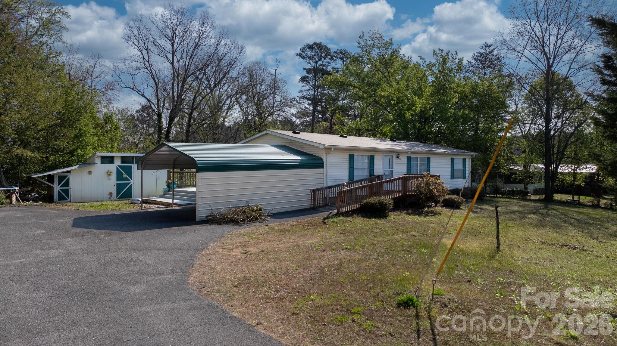 7911 Bailey Road Connelly Springs, NC 28612 - Photo 1 of 32 front view of a house with a yard