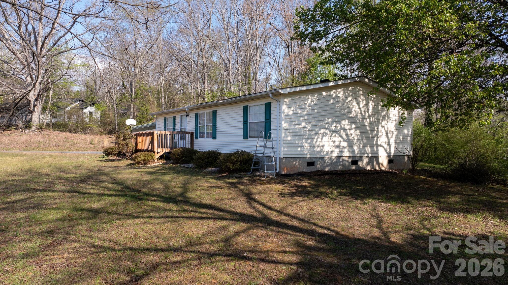 7911 Bailey Road Connelly Springs, NC 28612 - Photo 2 of 32 a view of a house with a yard