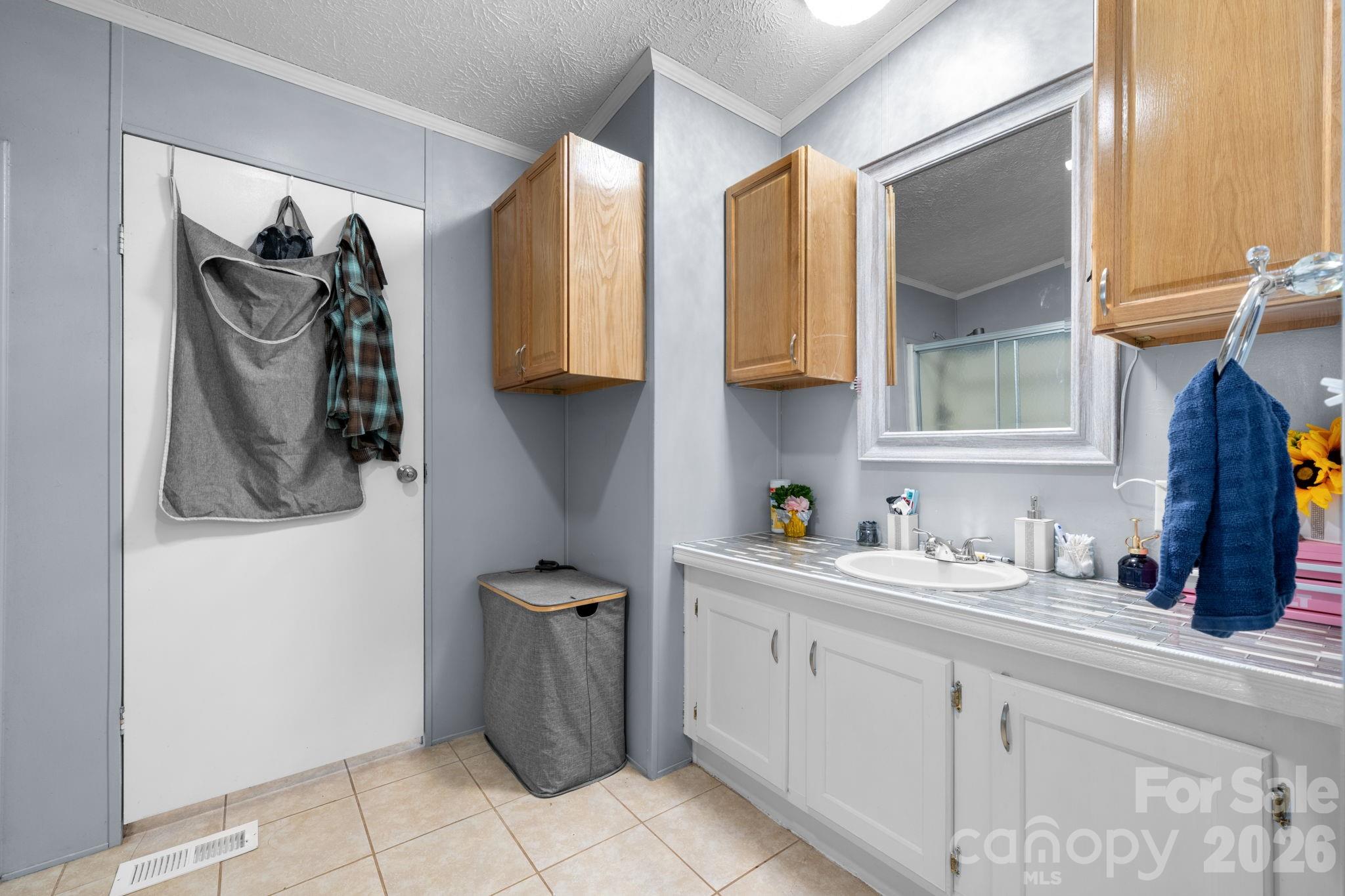 7911 Bailey Road Connelly Springs, NC 28612 - Photo 21 of 32 a kitchen with a sink and cabinets