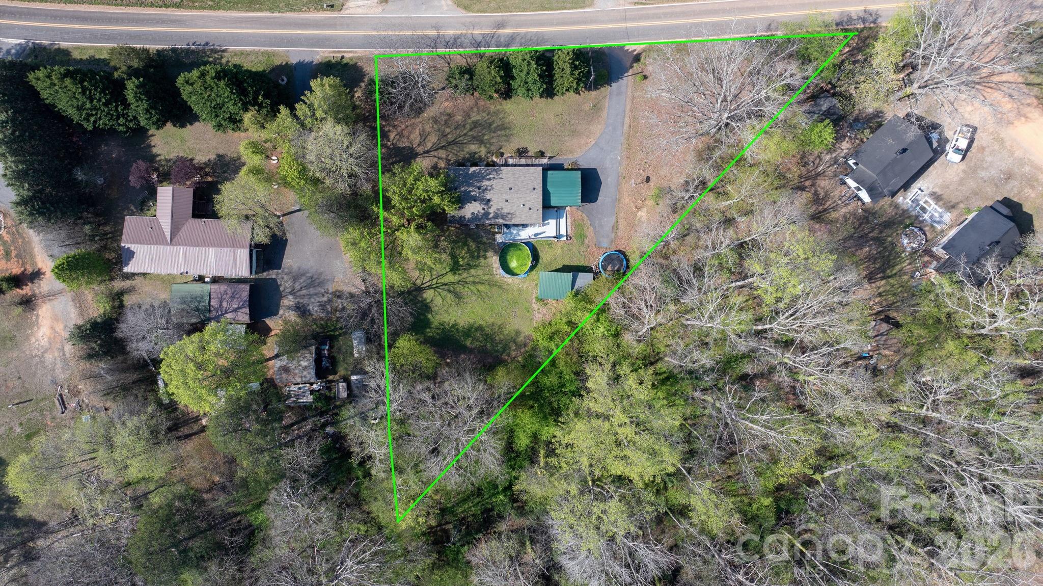 7911 Bailey Road Connelly Springs, NC 28612 - Photo 28 of 32 an aerial view of a house with a yard and lake view