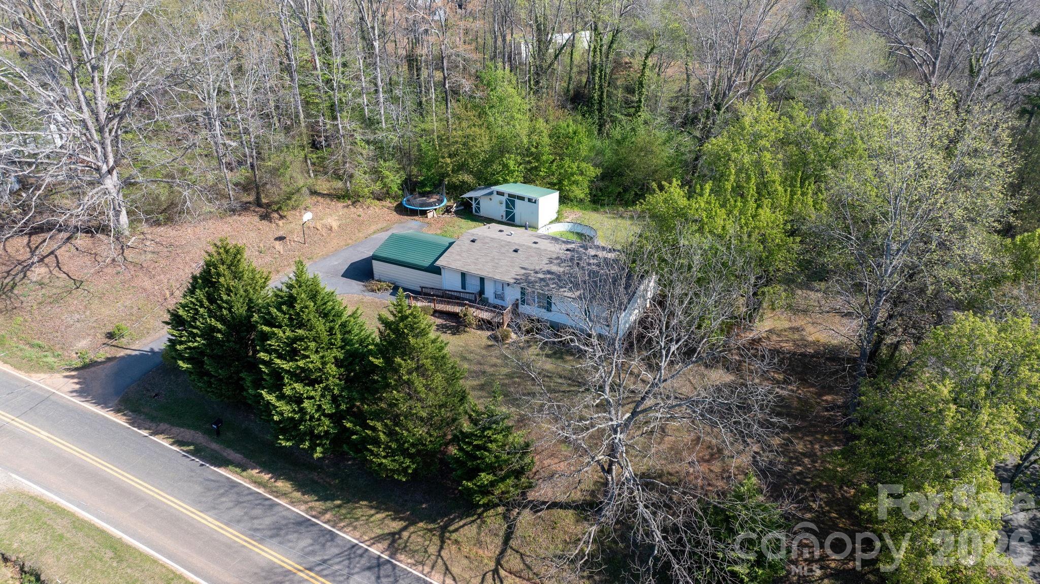 7911 Bailey Road Connelly Springs, NC 28612 - Photo 30 of 32 an aerial view of a house with a yard