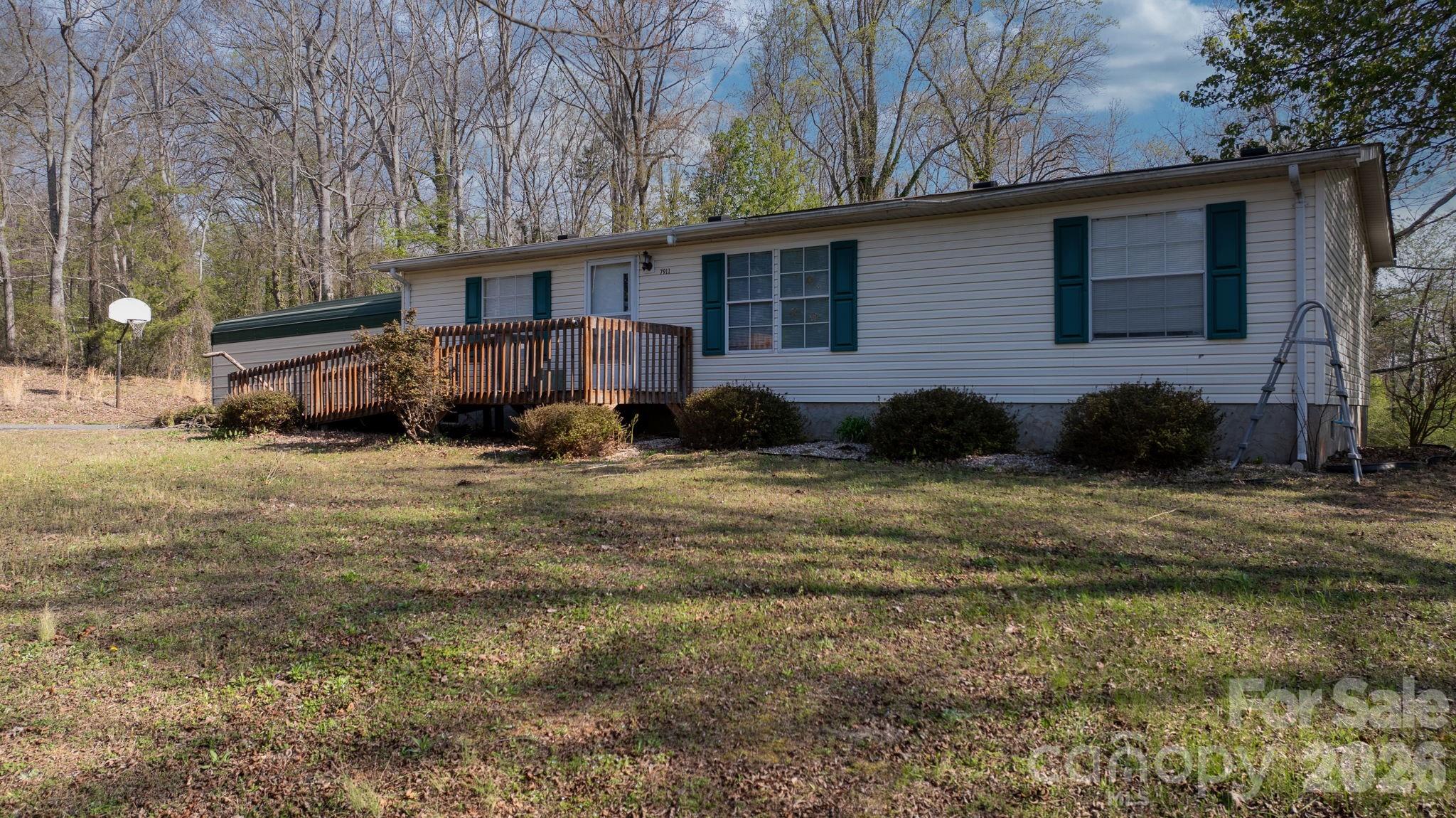7911 Bailey Road Connelly Springs, NC 28612 - Photo 3 of 32 a view of a house with a yard