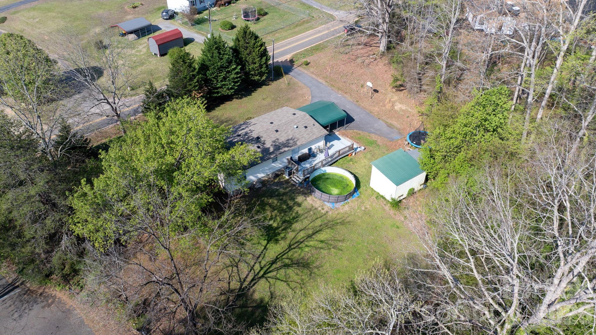 7911 Bailey Road Connelly Springs, NC 28612 - Photo 31 of 32 an aerial view of a house with a swimming pool