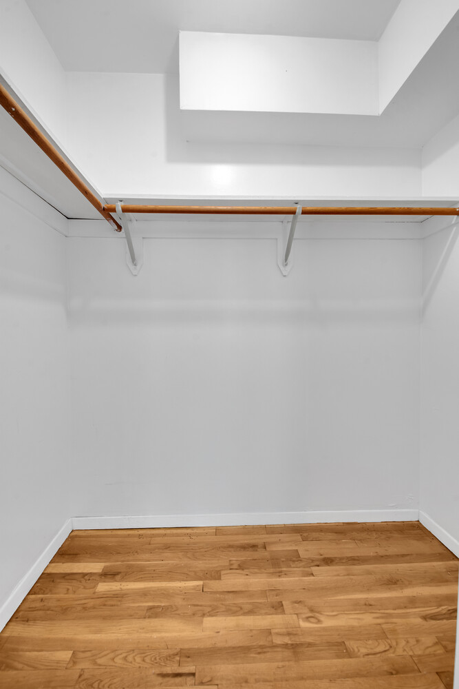 414 West 54th Street, Unit 5B Manhattan, NY 10019 - Photo 11 of 12 a view of a room with an empty shelf