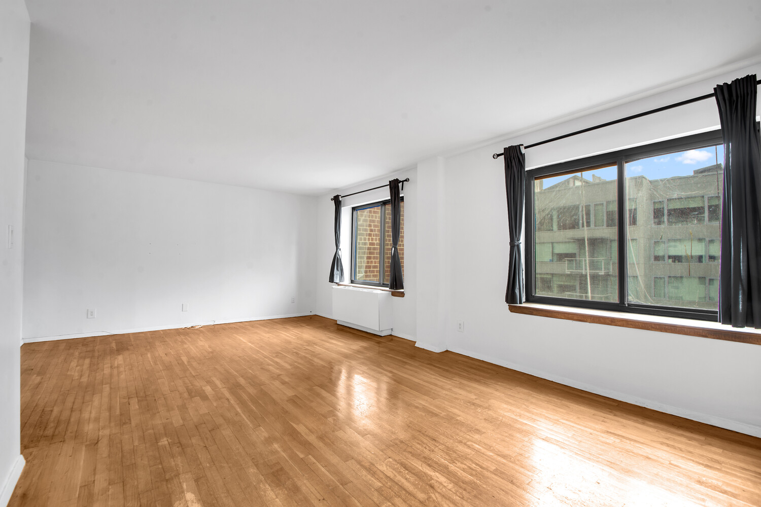 414 West 54th Street, Unit 5B Manhattan, NY 10019 - Photo 2 of 12 a view of an empty room with window