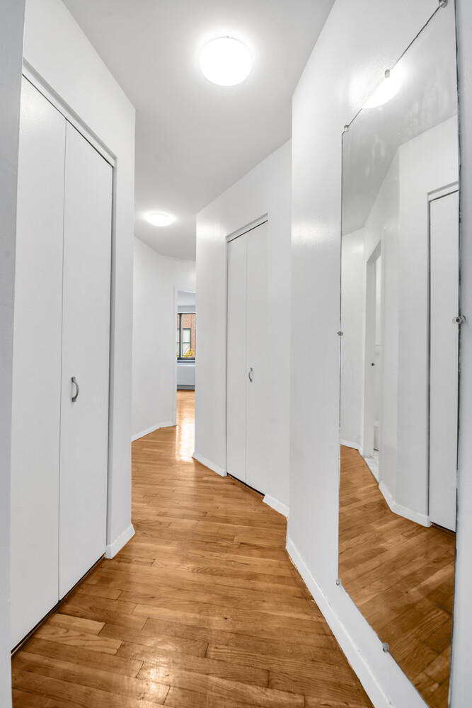 414 West 54th Street, Unit 5B Manhattan, NY 10019 - Photo 6 of 12 a view of an empty room and kitchen