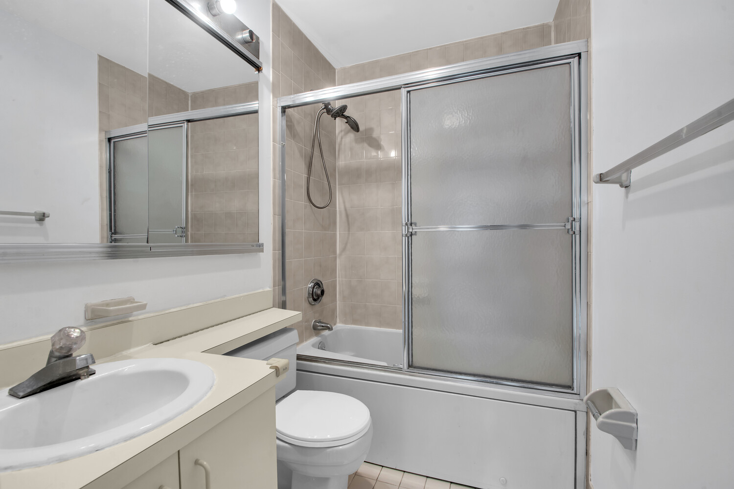 414 West 54th Street, Unit 5B Manhattan, NY 10019 - Photo 9 of 12 a bathroom with a sink toilet and shower