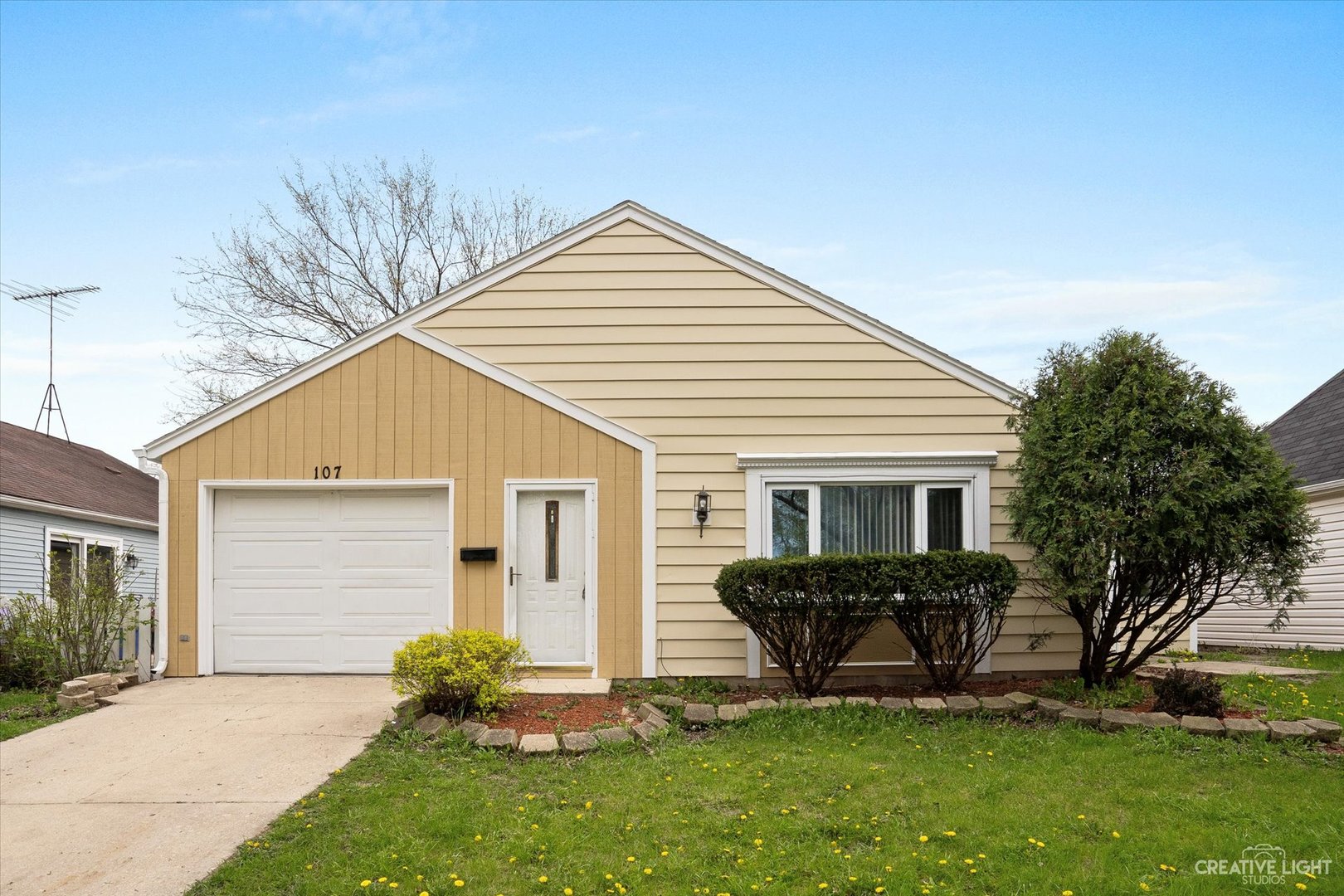 a view of a house with a backyard