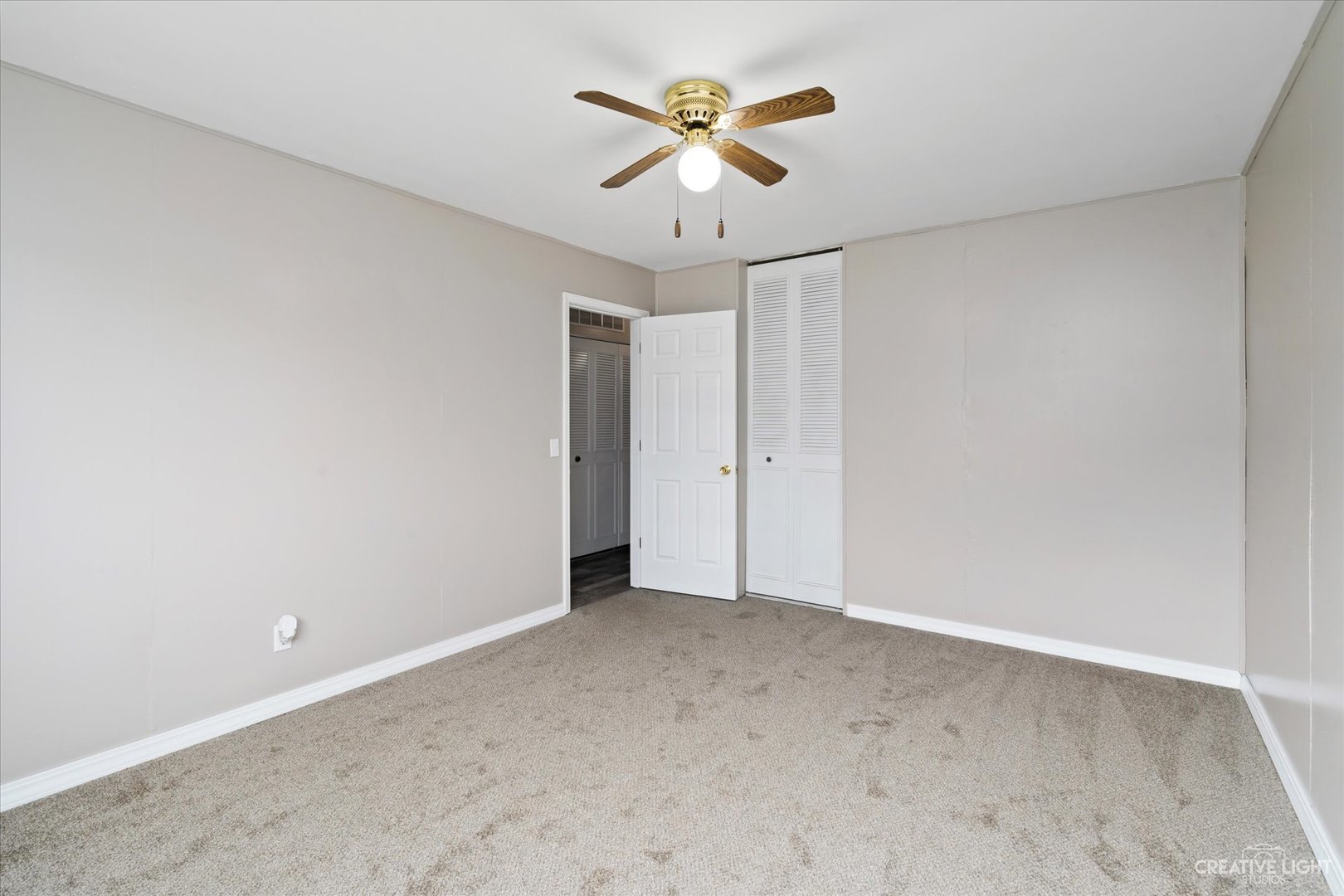 107 Heathgate Road Montgomery, IL 60538 - Photo 11 of 17 an empty room with ceiling fan and window