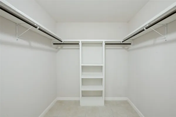 a view of an empty walk in closet