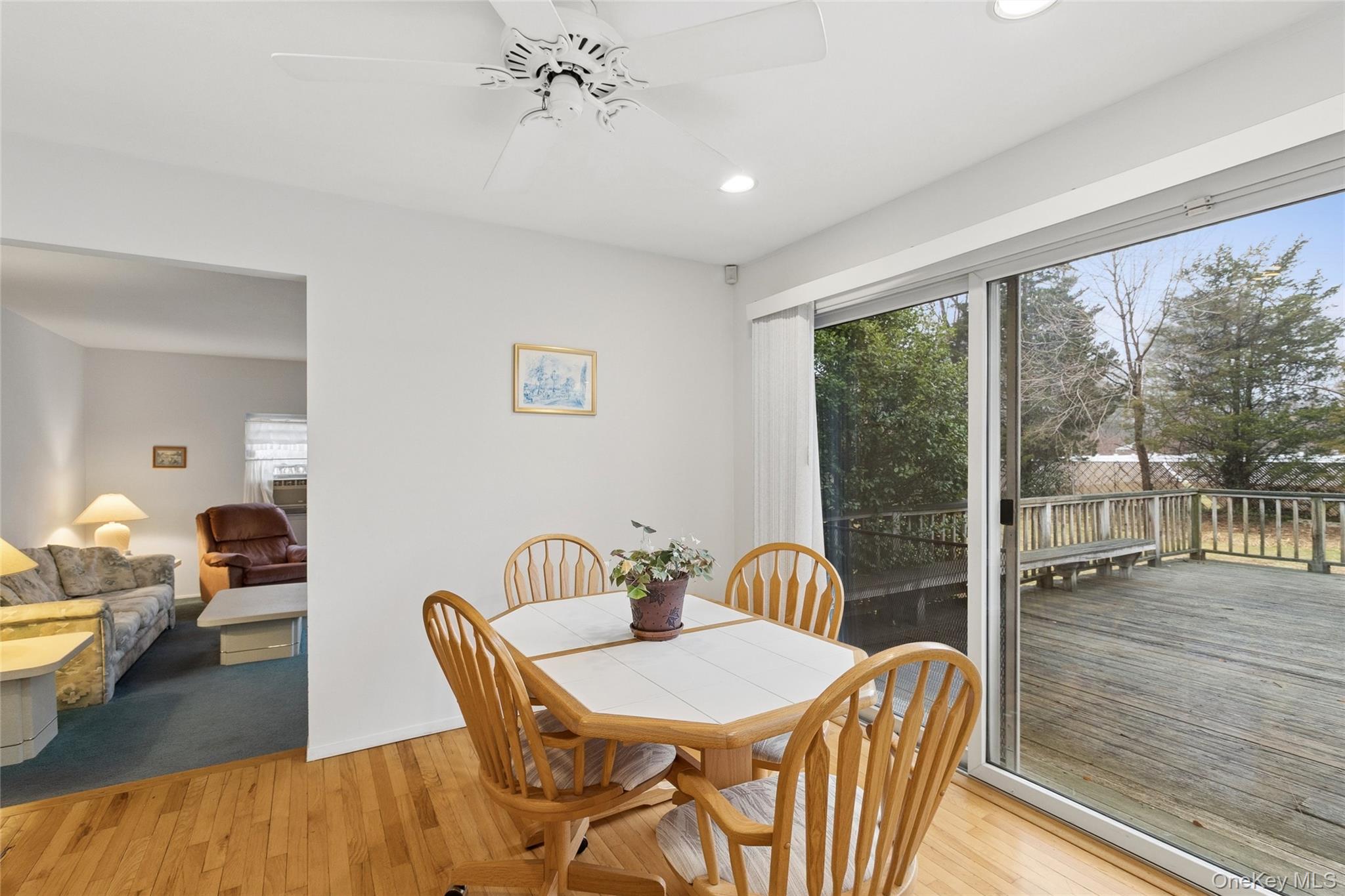 72 Jarvin Road Port Jefferson Station, NY 11776 - Photo 14 of 29 a view of a dining room with furniture wooden floor and chandelier