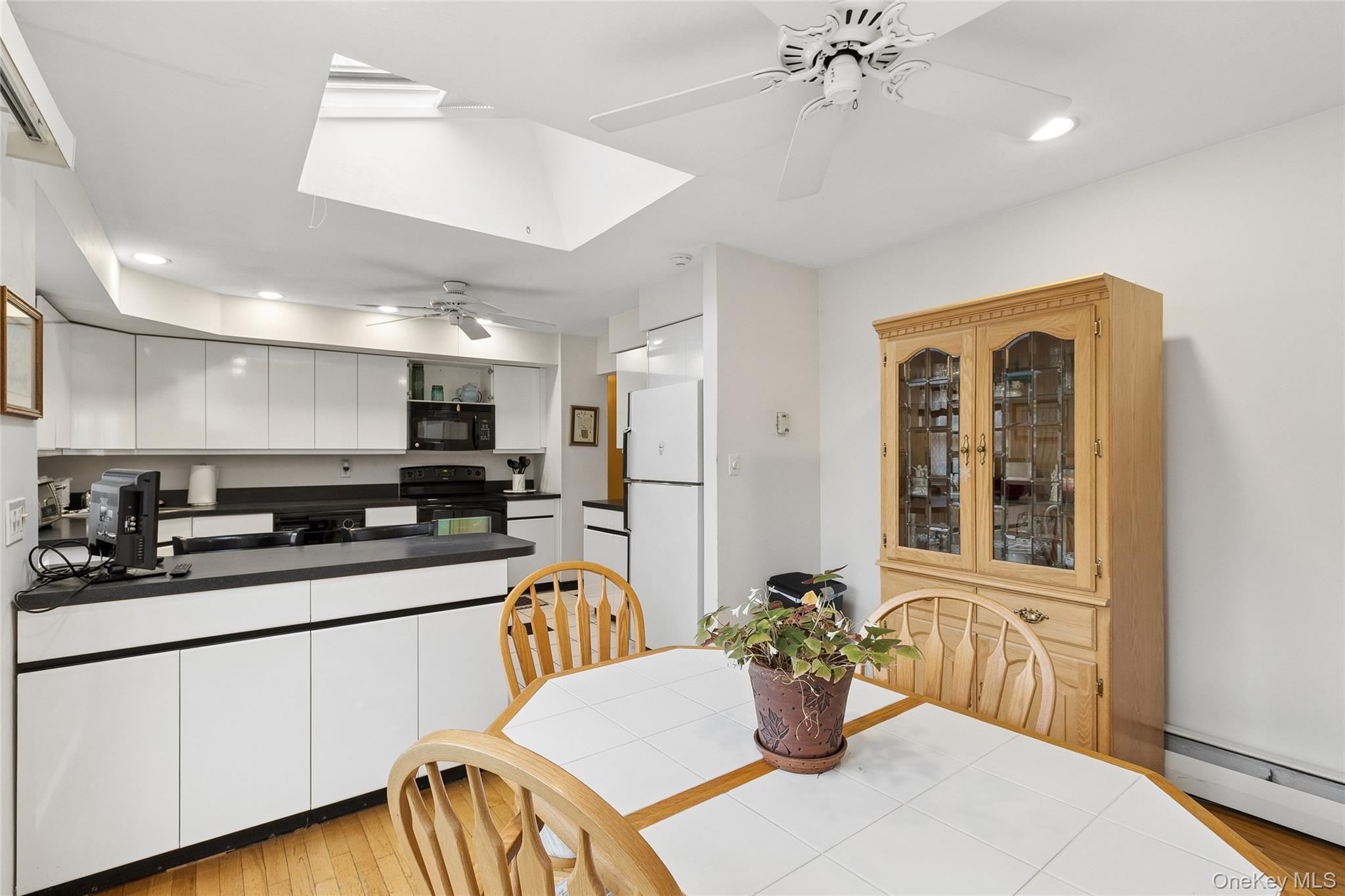 72 Jarvin Road Port Jefferson Station, NY 11776 - Photo 15 of 29 a kitchen with a sink and a refrigerator