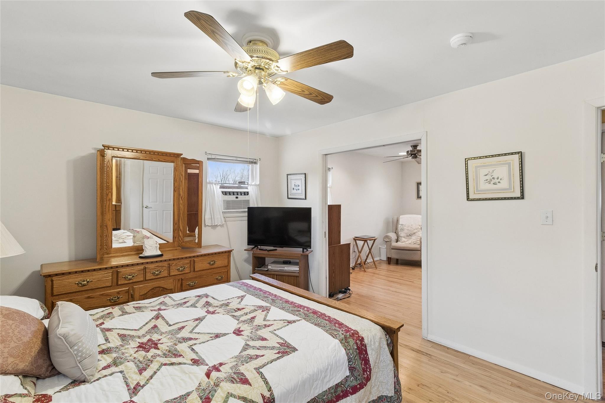 72 Jarvin Road Port Jefferson Station, NY 11776 - Photo 21 of 29 a bedroom with a bed and a flat screen tv