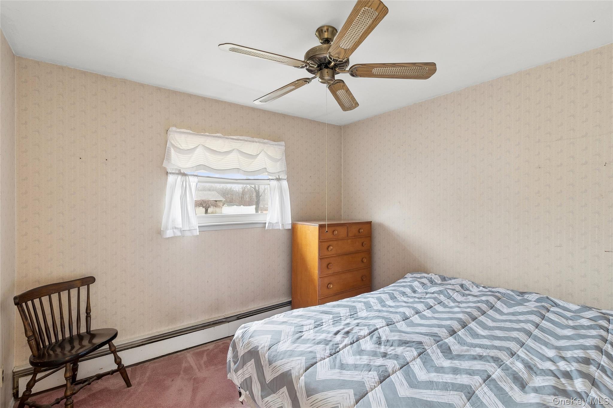 72 Jarvin Road Port Jefferson Station, NY 11776 - Photo 22 of 29 a bedroom with a bed and a window