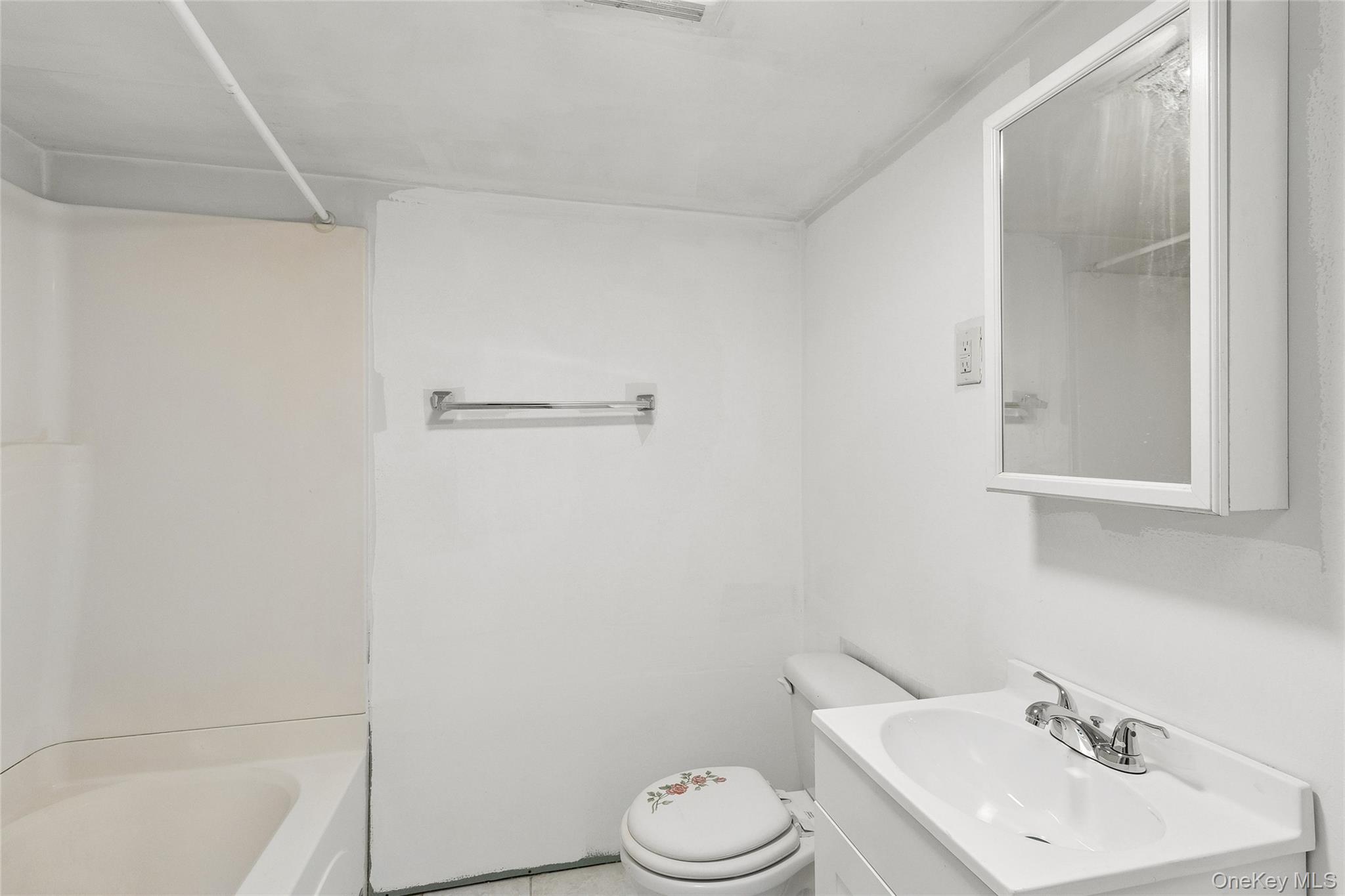 72 Jarvin Road Port Jefferson Station, NY 11776 - Photo 25 of 29 a bathroom with a sink toilet and vanity