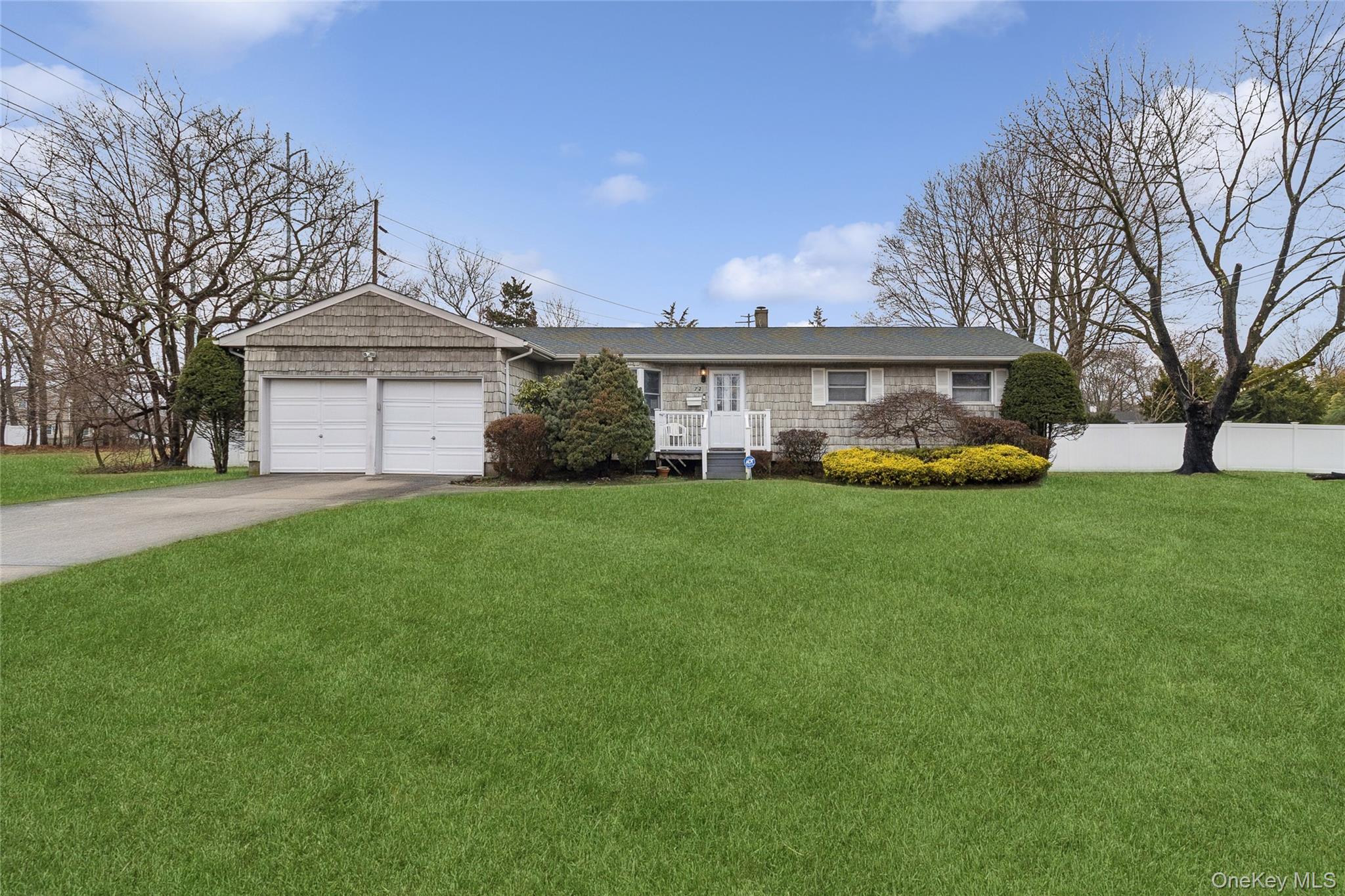72 Jarvin Road Port Jefferson Station, NY 11776 - Photo 27 of 29 a view of a house with a big yard and large trees
