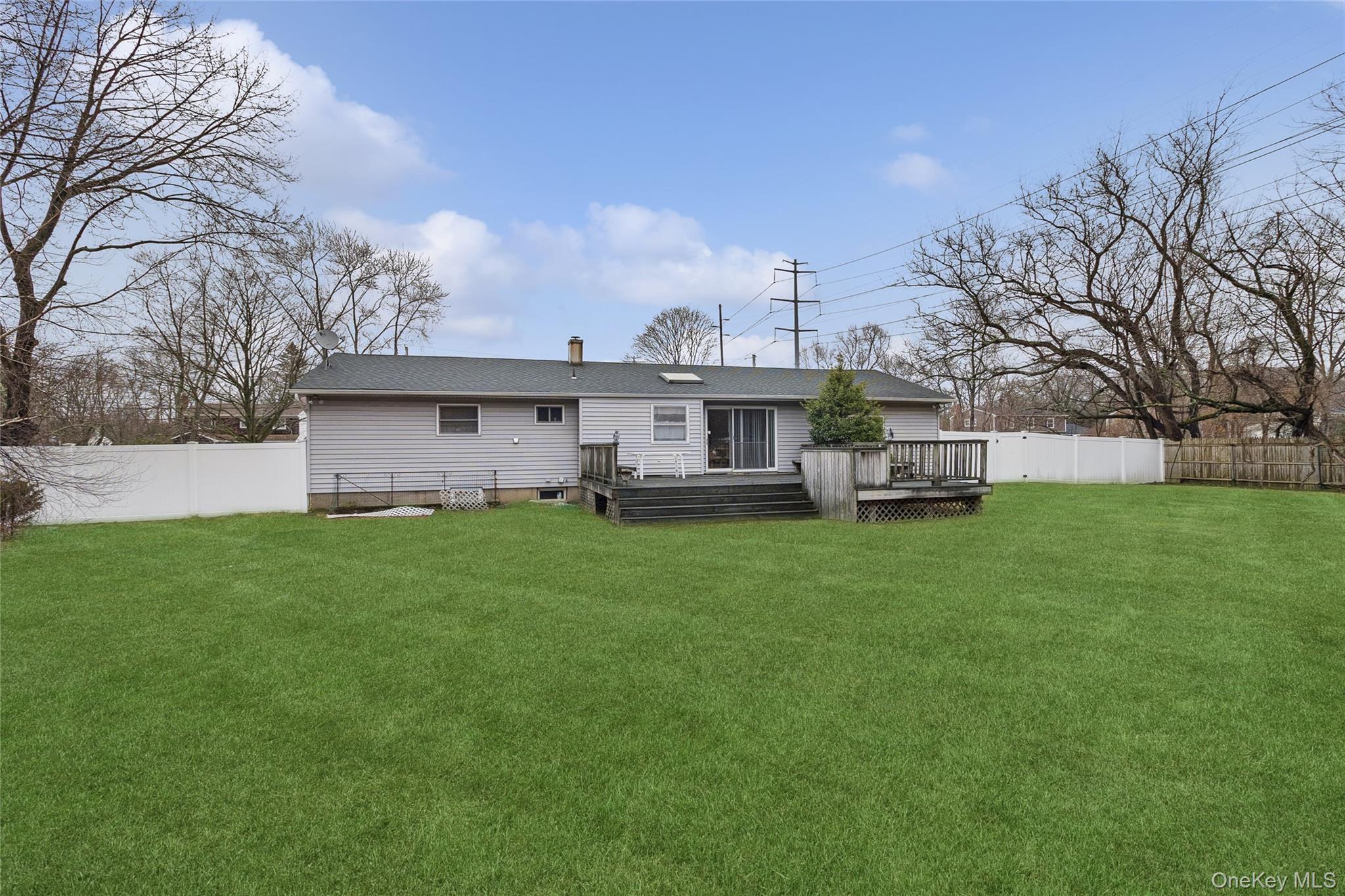 72 Jarvin Road Port Jefferson Station, NY 11776 - Photo 28 of 29 a view of a house with backyard sitting area and garden