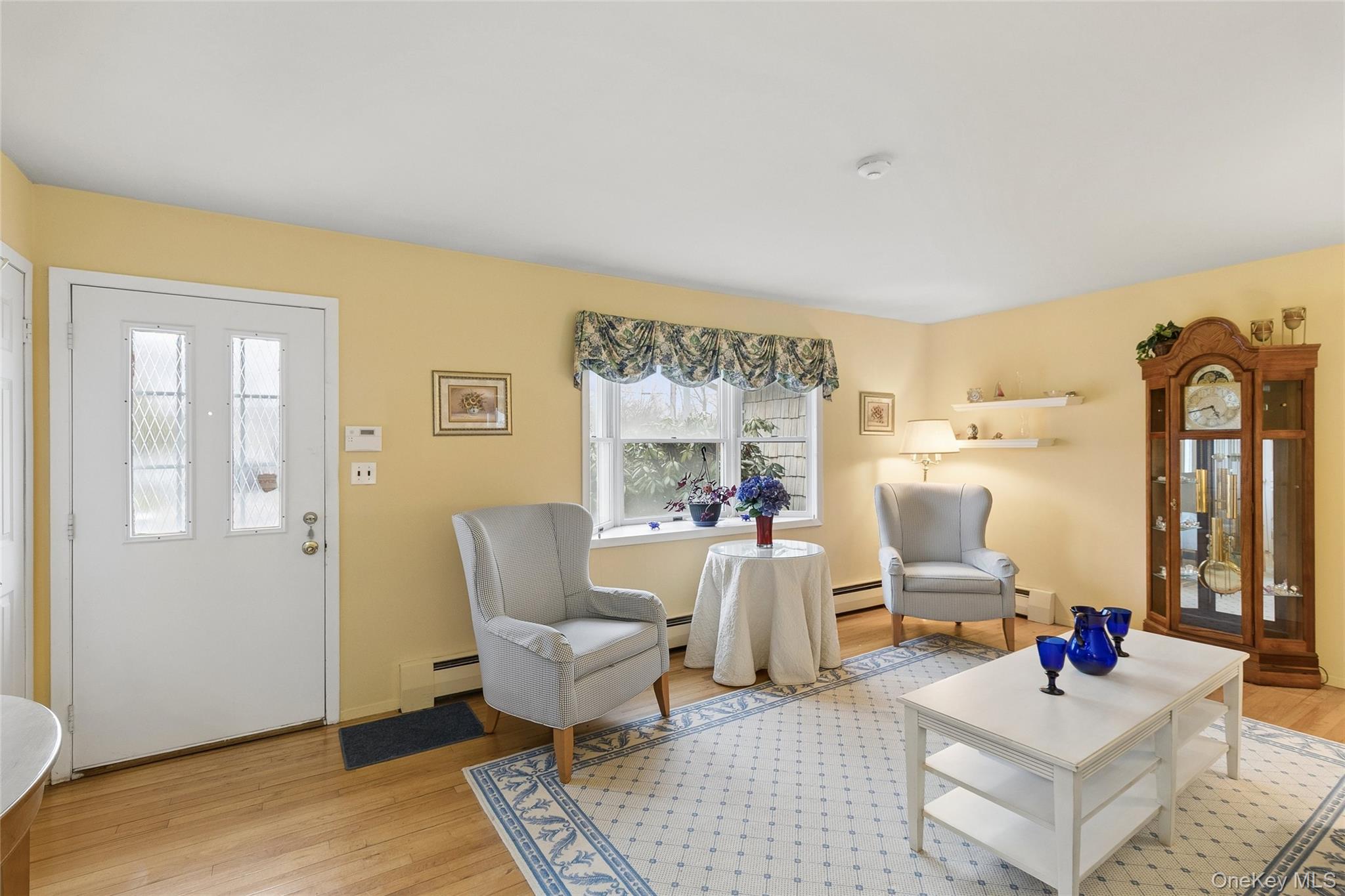 72 Jarvin Road Port Jefferson Station, NY 11776 - Photo 4 of 29 a living room with furniture and wooden floor