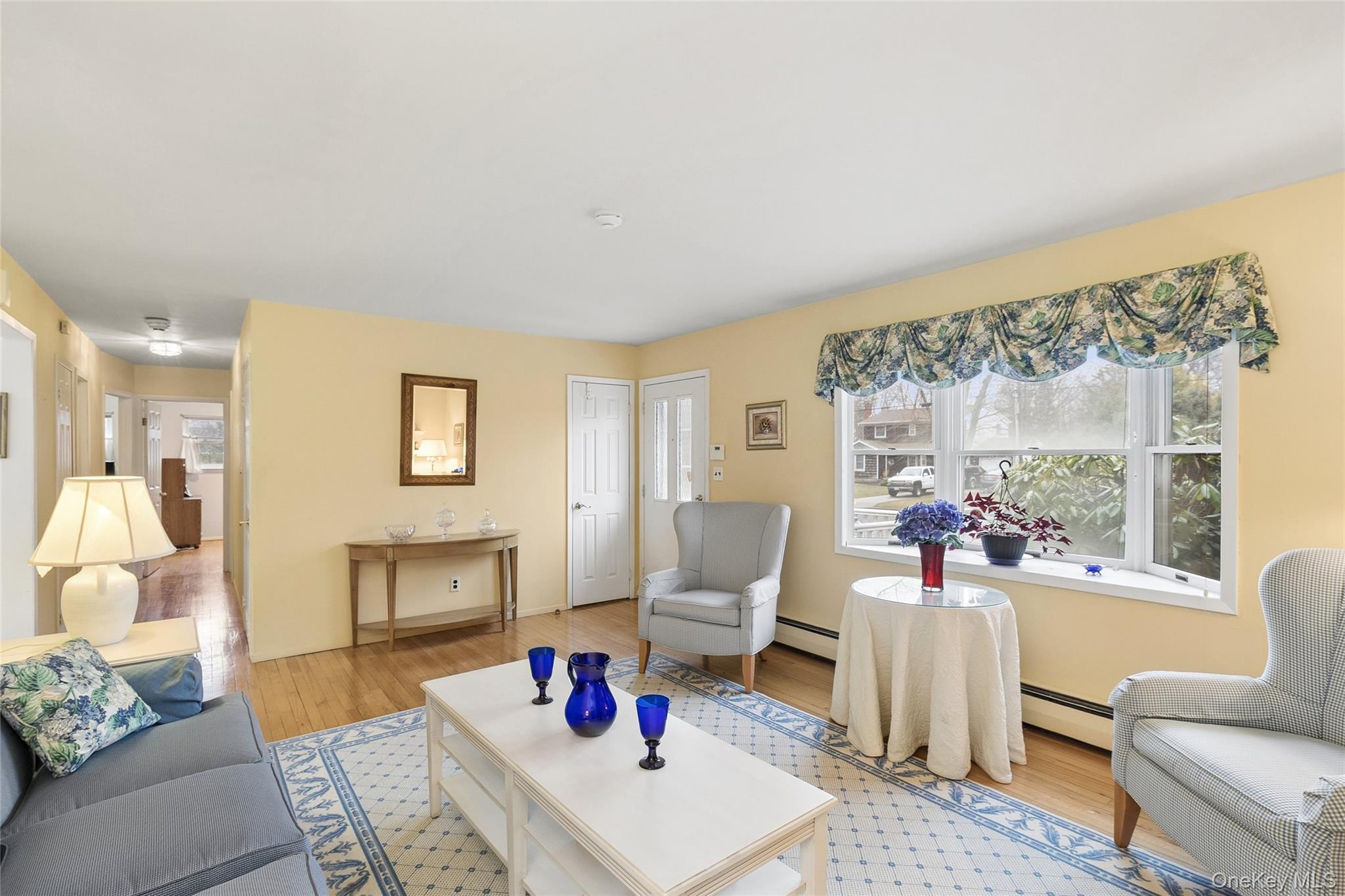 72 Jarvin Road Port Jefferson Station, NY 11776 - Photo 6 of 29 a living room with furniture and a large window