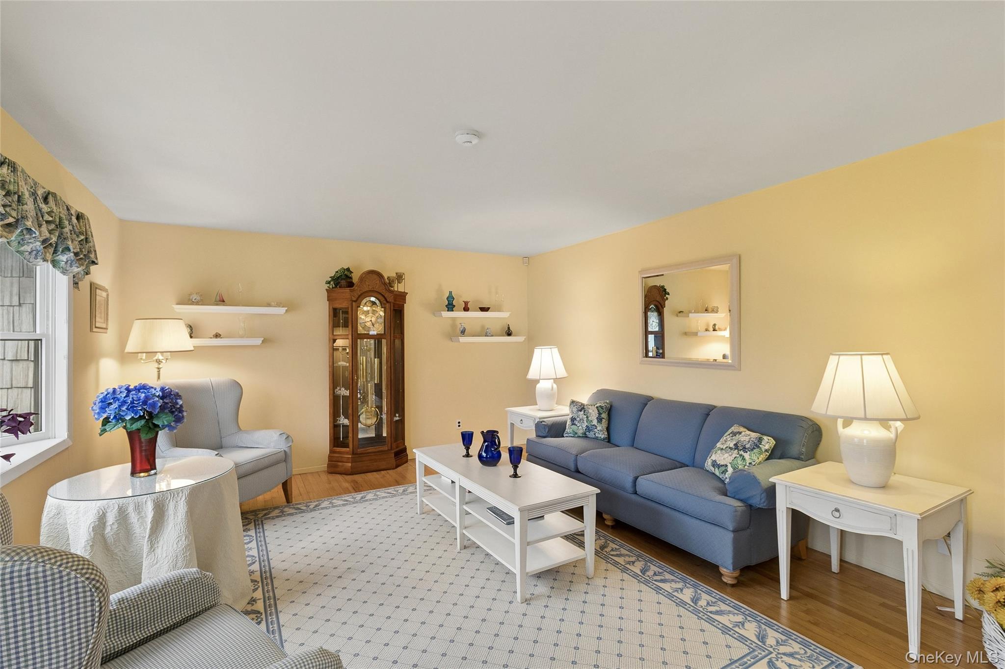72 Jarvin Road Port Jefferson Station, NY 11776 - Photo 8 of 29 a living room with furniture and a lamp