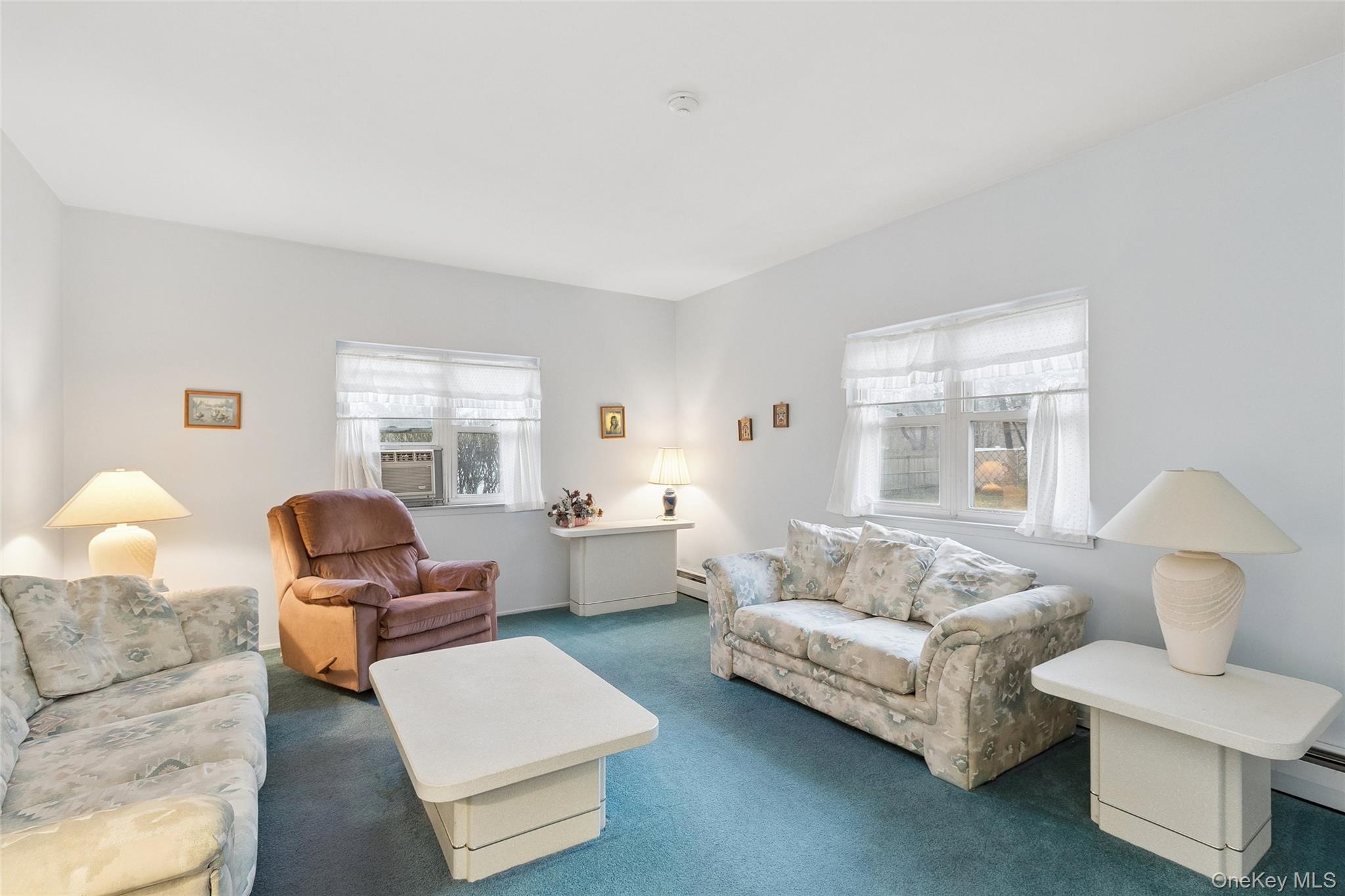 72 Jarvin Road Port Jefferson Station, NY 11776 - Photo 9 of 29 a living room with furniture and a window