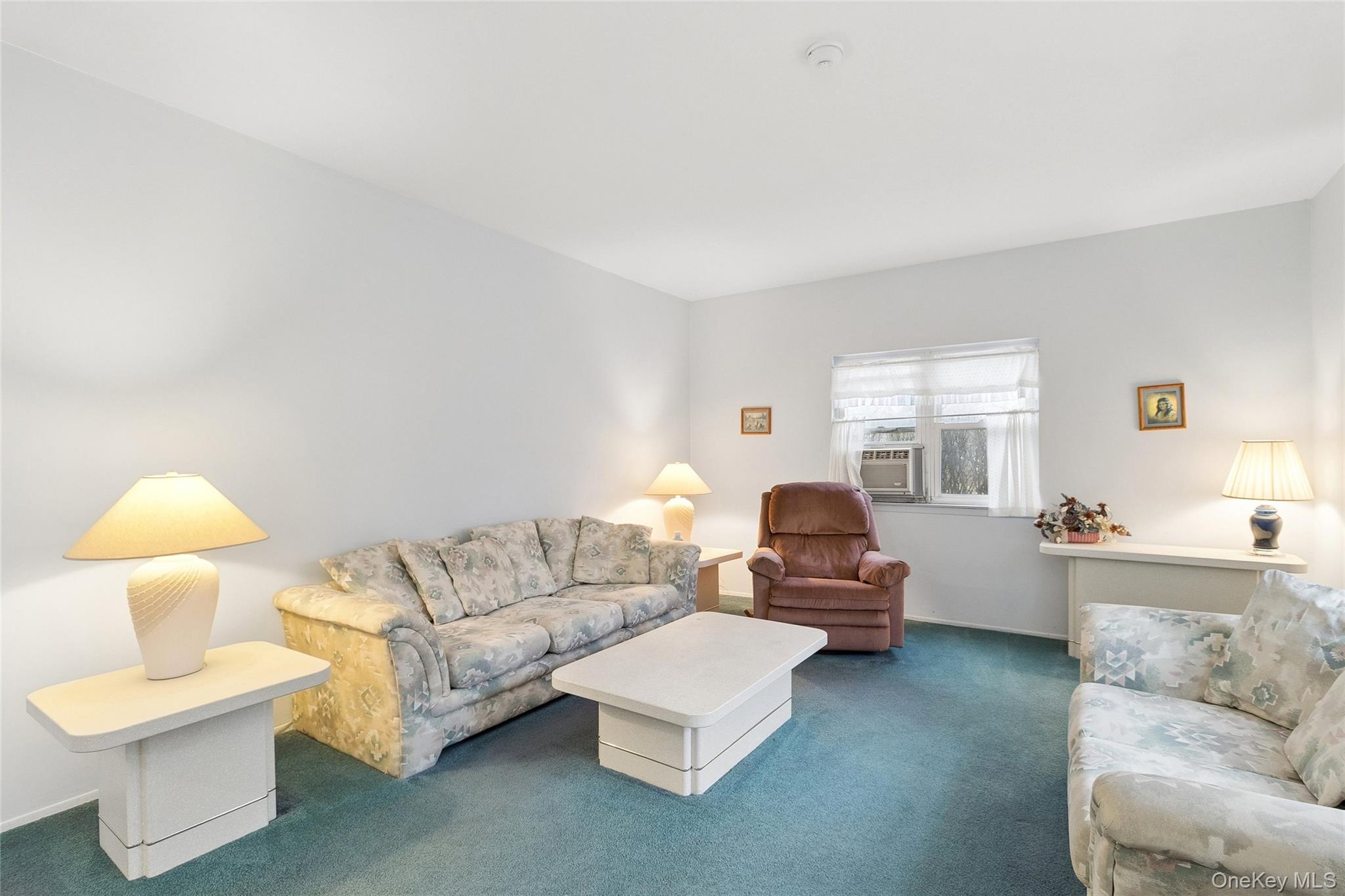 72 Jarvin Road Port Jefferson Station, NY 11776 - Photo 10 of 29 a living room with furniture and a lamp