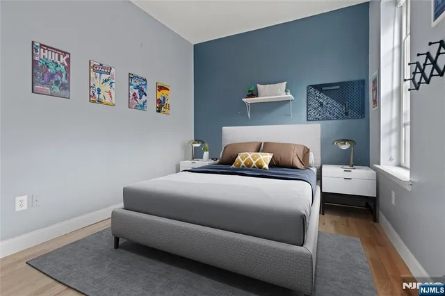 a bedroom with a bed and a couch