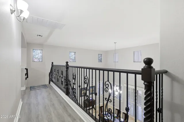 a bathroom with a sink double vanity granite tub shower and a mirror