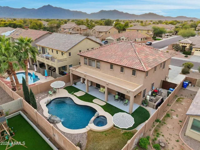 an aerial view of residential houses and outdoor space