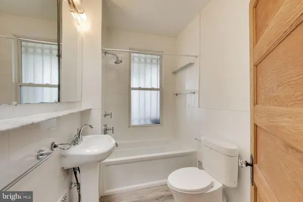 a view of a hallway with wooden ceiling