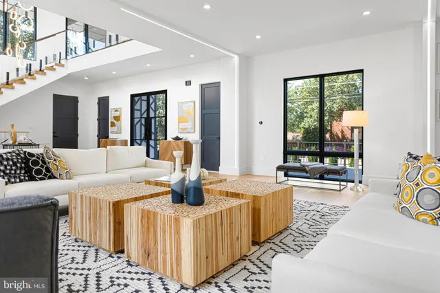 a kitchen with stainless steel appliances granite countertop a stove and a white cabinets