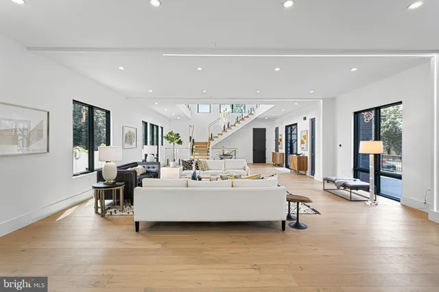 a close view of a refrigerator in kitchen and stainless steel appliances wooden cabinet