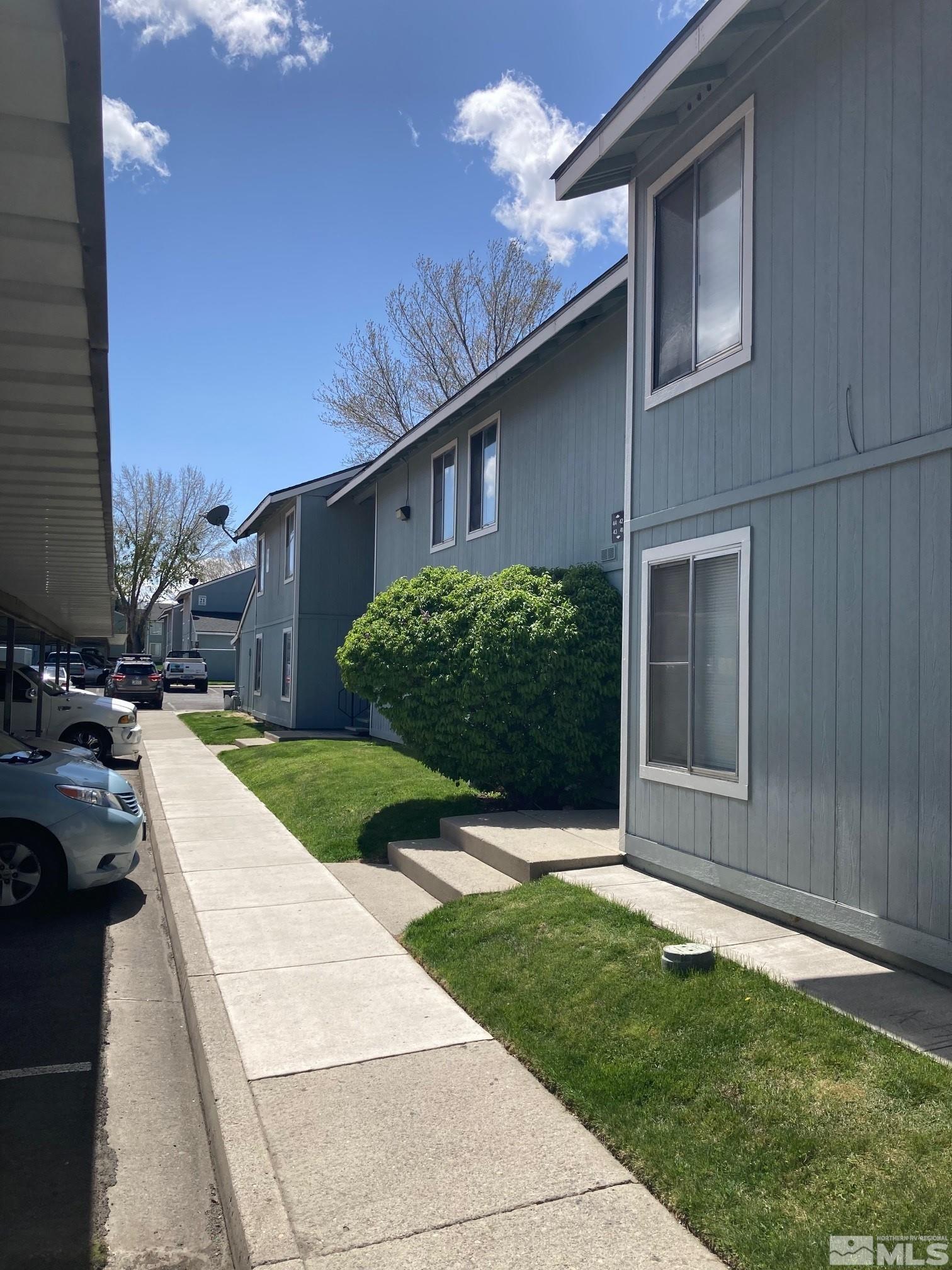 4600 Neil Road, Unit 36 Reno, NV 89502 - Photo 3 of 5 a view of a house with a yard and plants