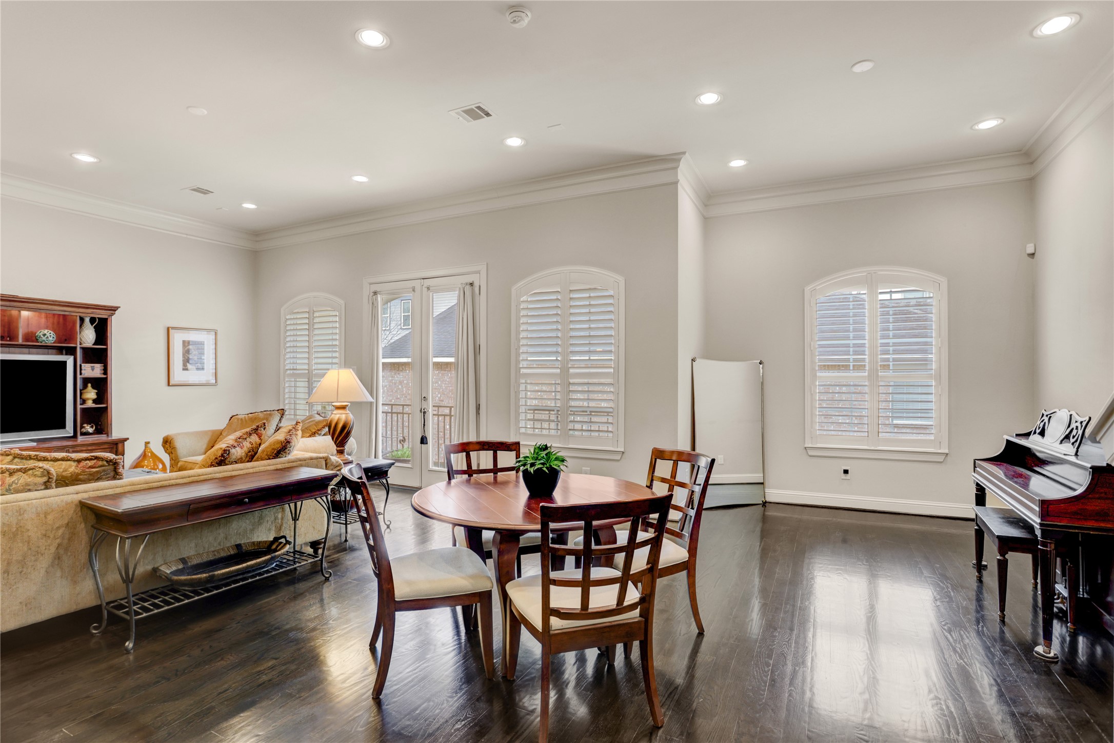 5637 Kiam Street, Unit D Houston, TX 77007 - Photo 1 of 12 a view of a dining room with furniture and wooden floor