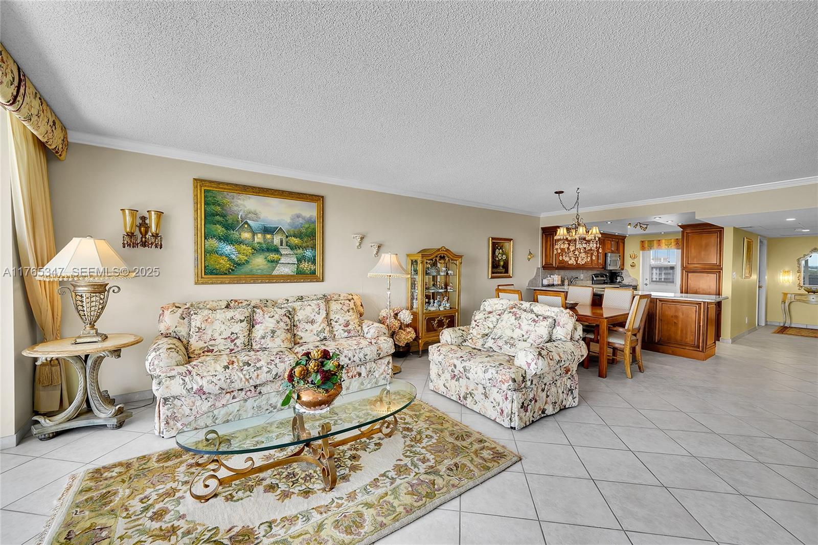 2681 South Course Drive, Unit 912 Pompano Beach, FL 33069 - Photo 12 of 44 a living room with furniture and painting on the wall