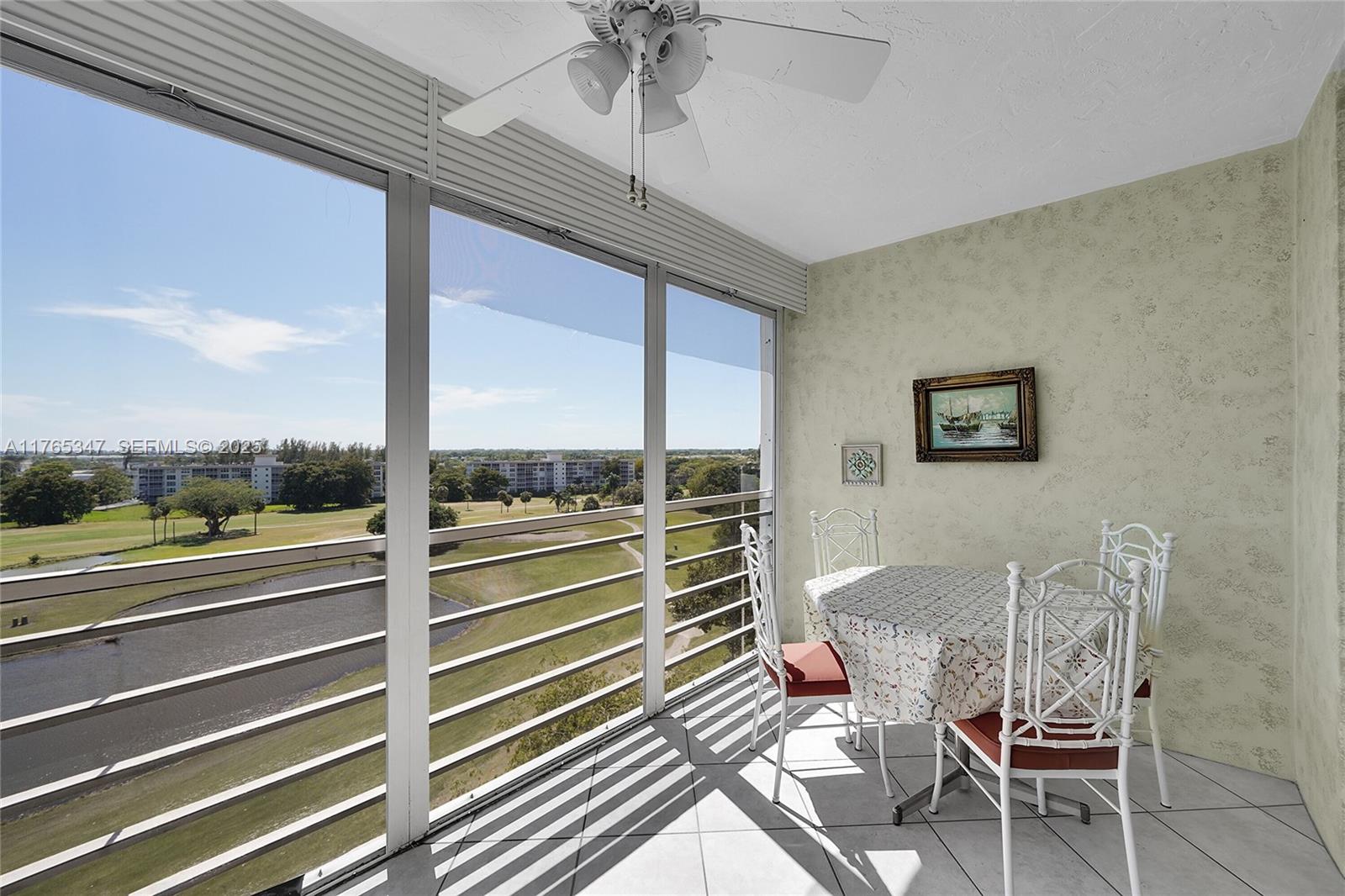 2681 South Course Drive, Unit 912 Pompano Beach, FL 33069 - Photo 14 of 44 a view of a dining room with furniture window and outside view