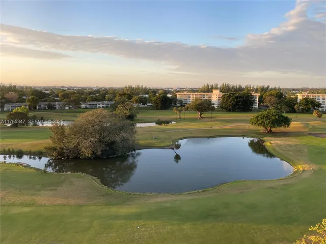 a view of a lake with a yard